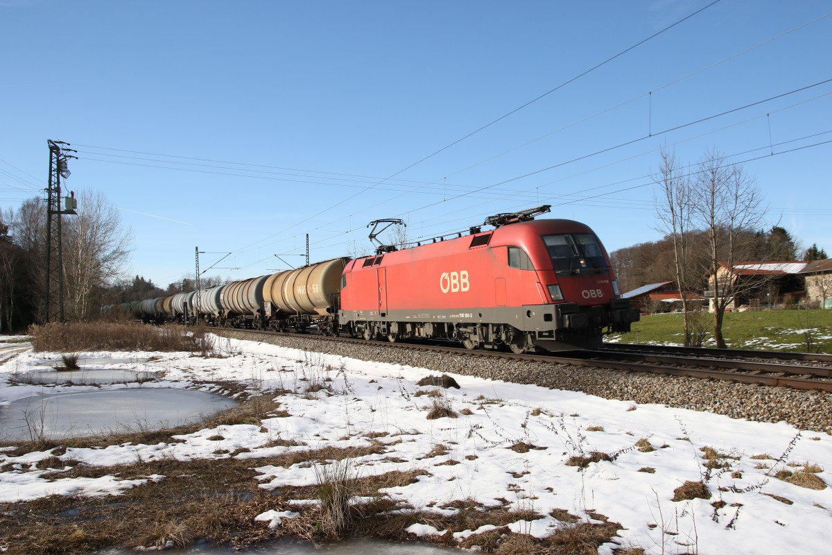 1116 184-3 war am 6. Januar 2015 bei bersee mit einem Kesselwagenzug in Richtung Salzburg unterwegs.