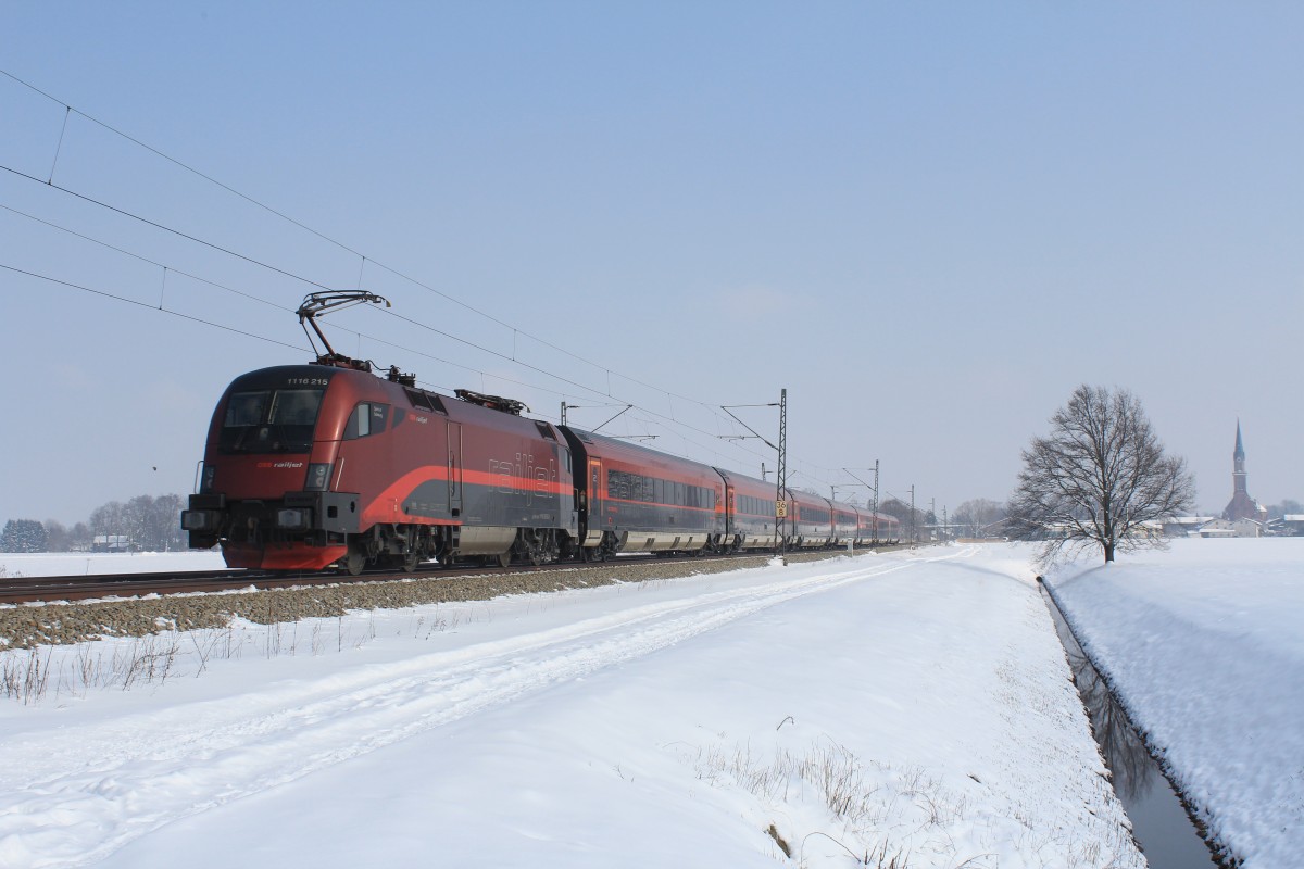 1116 215-3 war am 23. Februar 2013 bei bersee schiebend in Richtung Salzburg im Einsatz.