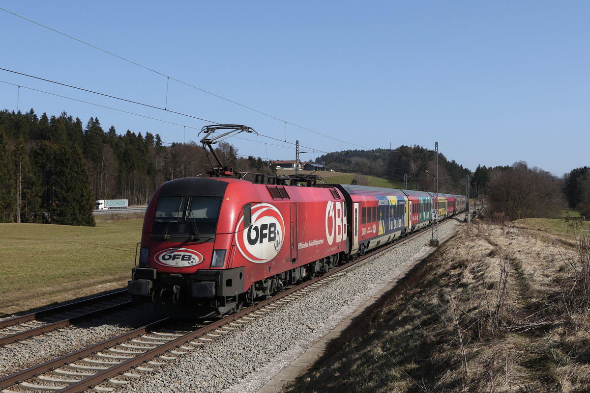 1116 249 war mit dem  FB-Railjet  am 25. Februar 2021 bei Grabensttt im Chiemgau auf dem Weg nach Salzburg.
