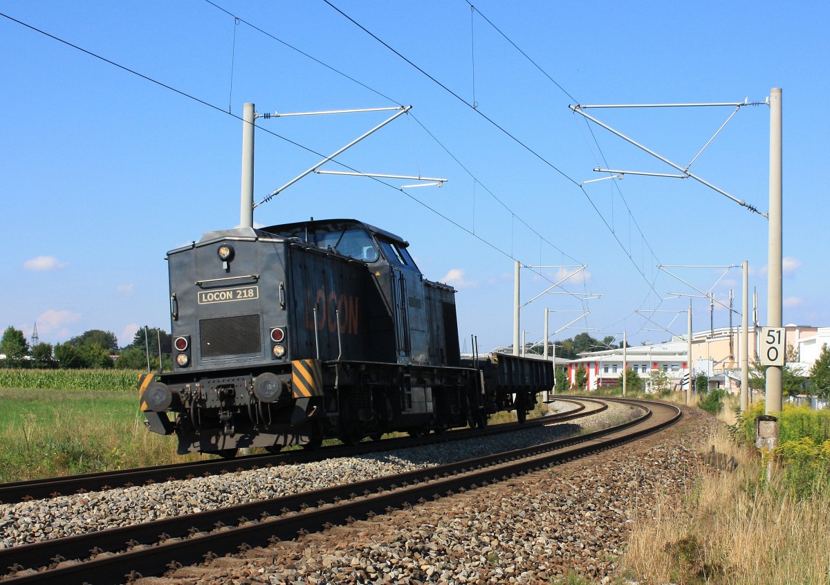 203 124-3 von  LOCON  war am 30.08.2013 als  LOCON 218  mit einem Flachwagen
bei Traunstein in Richtung Rosenheim unterwegs. 
