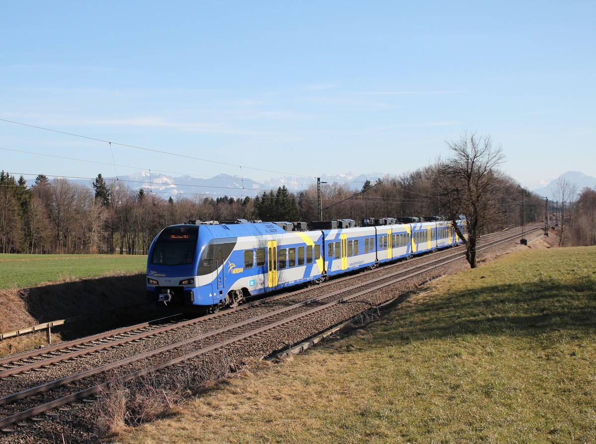 ET 310 ist am 7. Mrz 2015 bei Hilperting in Richtung Mnchen unterwegs.