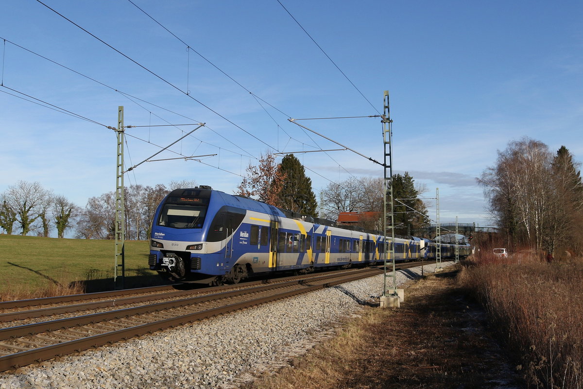 ET 313 war am 30. Dezember 2019 bei Grabensttt in Richtung Mnchen unterwegs.