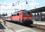 111 210-1 am 10. August 2013 bei der Einfahrt in den Bahnhof von Traunstein.