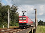 112 178-9 war am 30. August 2016 bei Wulfsmoor mit einem Regionalzug in Richtung Flensburg unterwegs.