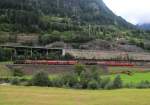 BR 185/409994/185-114-6-und-185-123-7-waren 185 114-6 und 185 123-7 waren mit einem Gterzug am 10. August 2014 bei Wassen auf der Gotthard-Strecke talwrts unterwegs.