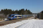 ET 328 auf dem Weg nach Rosenheim am 26. Januar 2022 bei Grabensttt im Chiemgau.