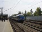 ET 306 durchfhrt am 12. April 2014 auf dem Weg nach Mnchen den Bahnhof von Zorneding.