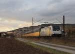 185 681-4 zieht am 21. Februar 2014 einen Autozug bei Thüngersheim durch das Maintal.