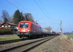 1016 029-9 ist am 7. Mrz 2014 mit einem Autozug bei Weisham in Richtung Salzburg unterwegs.