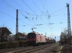 1016 041 mit einem Güterzug am 12. März 2014 beim durchfahren des Bahnhofs von Prien am Chiemsee.