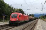 1016 042-2 durchfhrt am 14. September 2013 mit einem gemischten Gterzug den Bahnhof von Prien am Chiemsee.
