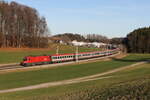 1016 002 mit dem  EC 113  am 27. Dezember 2023 bei Axdorf im Chiemgau.