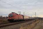 1116 084-5 ist am 4. Januar 2014 bei Ostermnchen in Richtung Mnchen unterwegs.