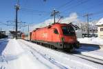 1116 094-4 bei der Ausfahrt aus dem Bahnhof von St. Johann am 20. Februar 2013.
