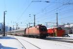 1116 110-6 bei der Ausfahrt aus dem Bahnhof von St. Johann in Tirol am 10. Februar 2013.