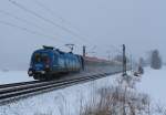 1016 023  BB Grne Schiene  kam am 9. Februar 2013 im dichten Schneetreiben aus Salzburg. Aufgenommen bei bersee am Chiemsee.
