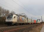 roland-spedition/326464/1216-955-von-der-roland-spedition 1216 955 von der 'Roland Spedition' mit einem Containerzug bei Thüngerheim am 21. Februar 2014.