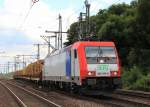 482 042-9 der  SETG  zieht am 31. Juli 2013 einen Holzzug durch Hamburg-Harburg.