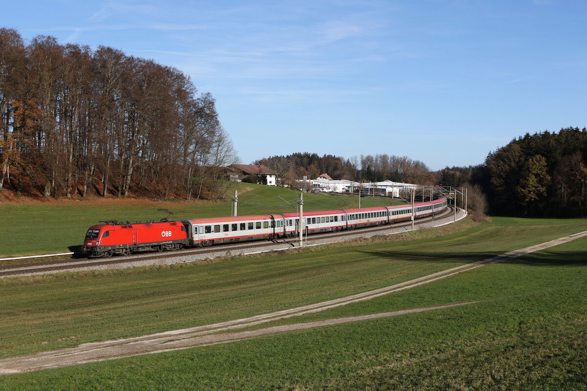 1116 079 war am 24. November 2024 mit einem  EC  bei Axdorf in Richtung Mnchen unterwegs.